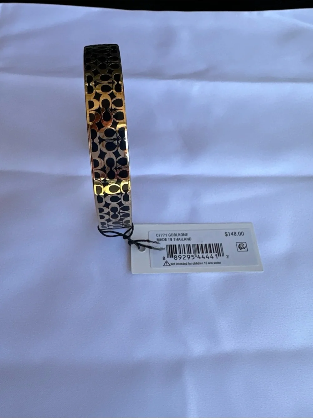 Coach Gold-Tone Watch Bracelet with Black Signature Pattern